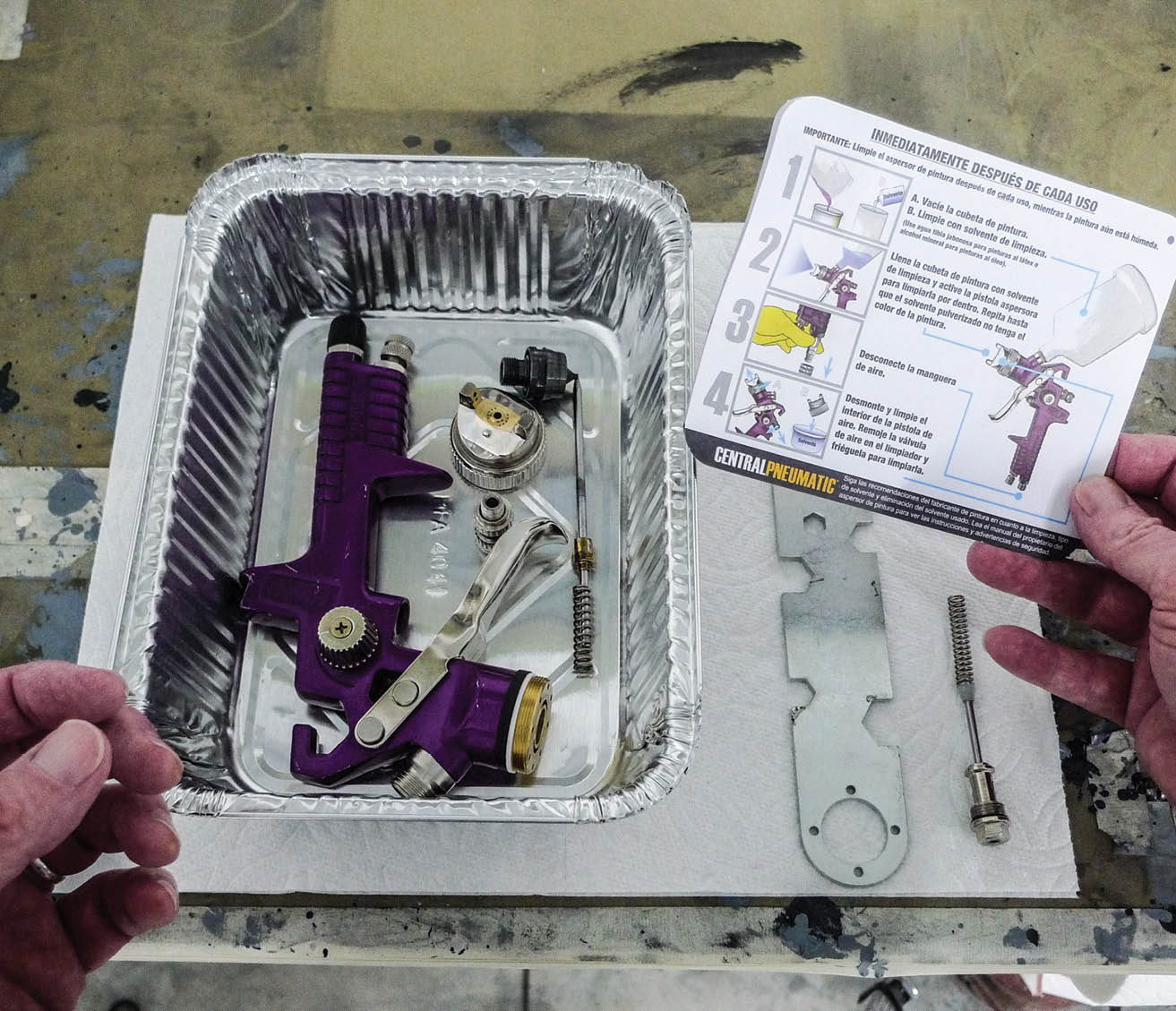 Spray gun and parts in tin tray