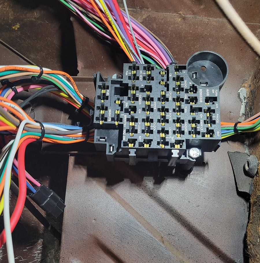 Srbinovich completely rewired the wagon from front to back with an American Autowire kit. The fuse block was mounted to the cowl on the left side.
