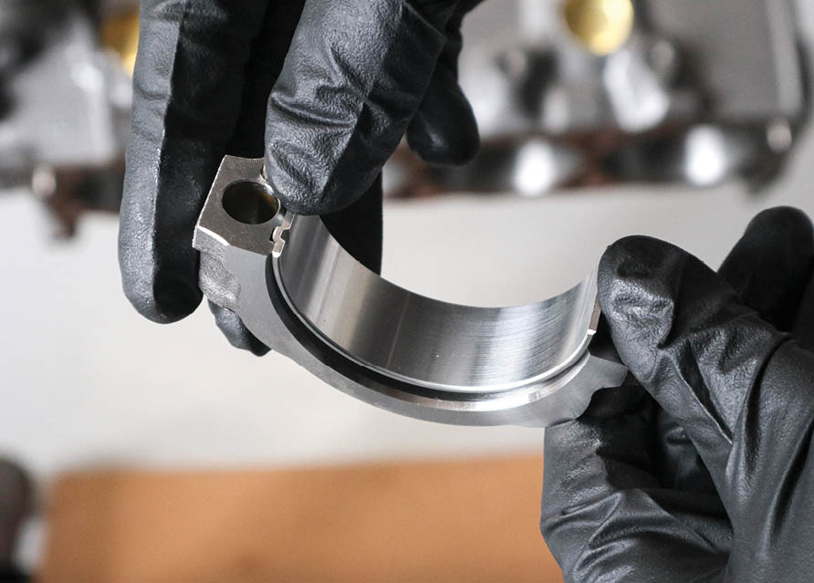 we installed the connecting rod bearings and double-checked the big end clearance using similar tools and techniques as we did for the main journals