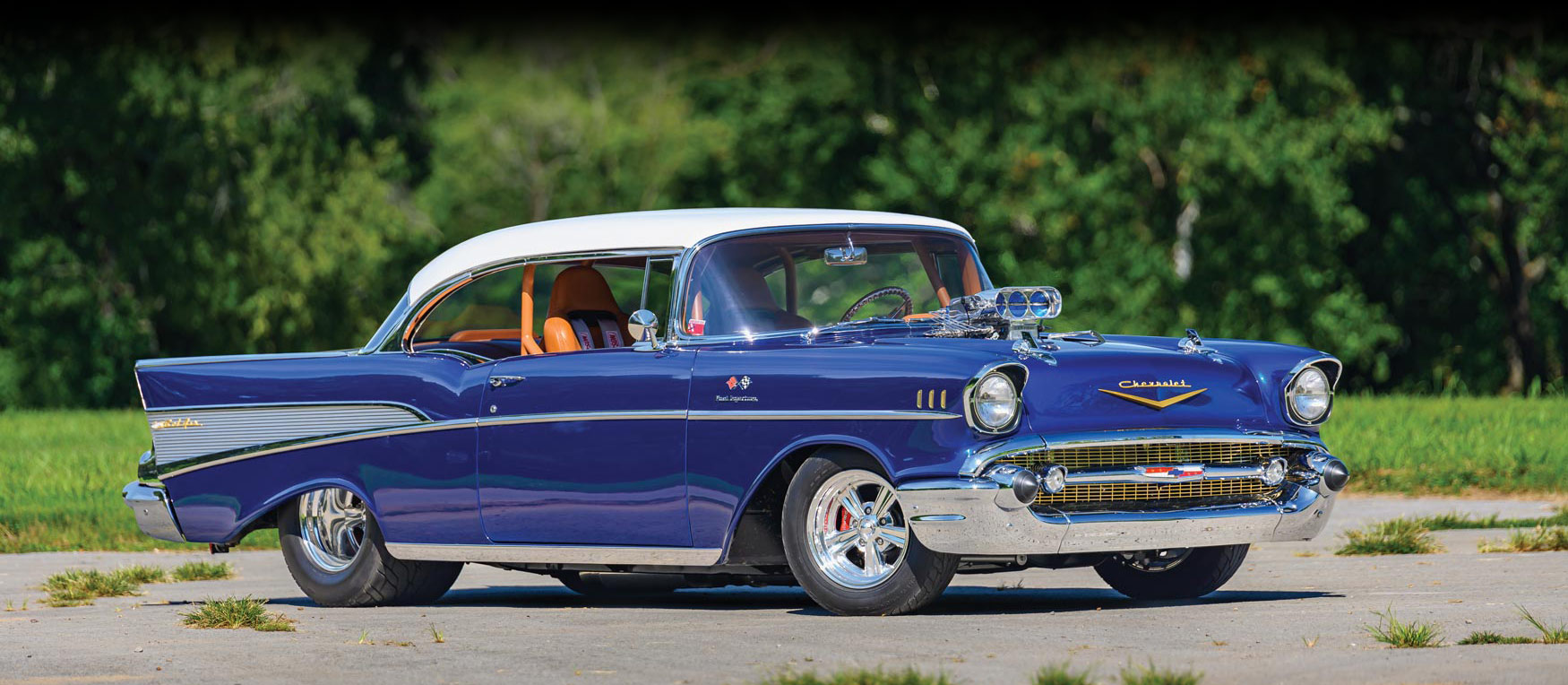 blue '57 bel air, white top, cognac interior, chrome grill and wheels