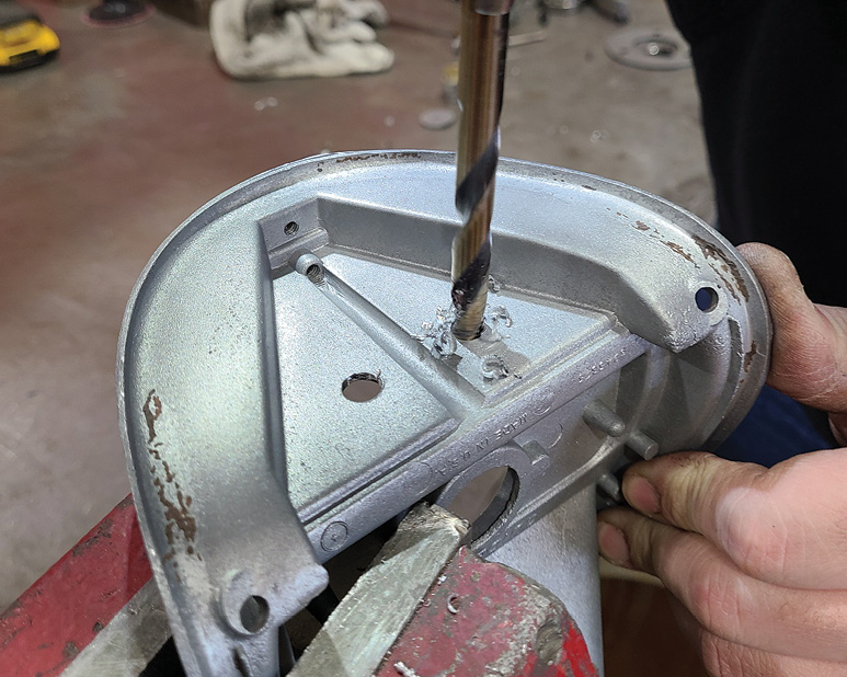 Cantrell then drills out the marks and attaches the housing to the arm.