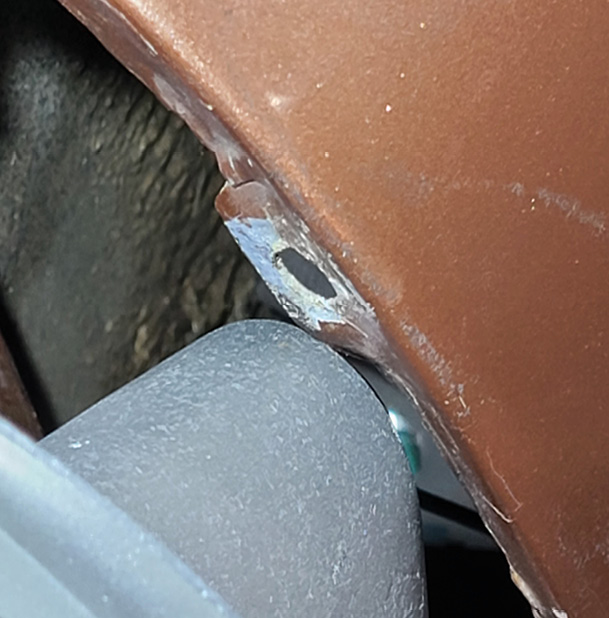 After checking the complete swing of the arm, Cantrell finds the housing barely rubs the upper right edge of the taillight opening, so he’ll grind that away until it doesn’t interfere with the housing’s movement.