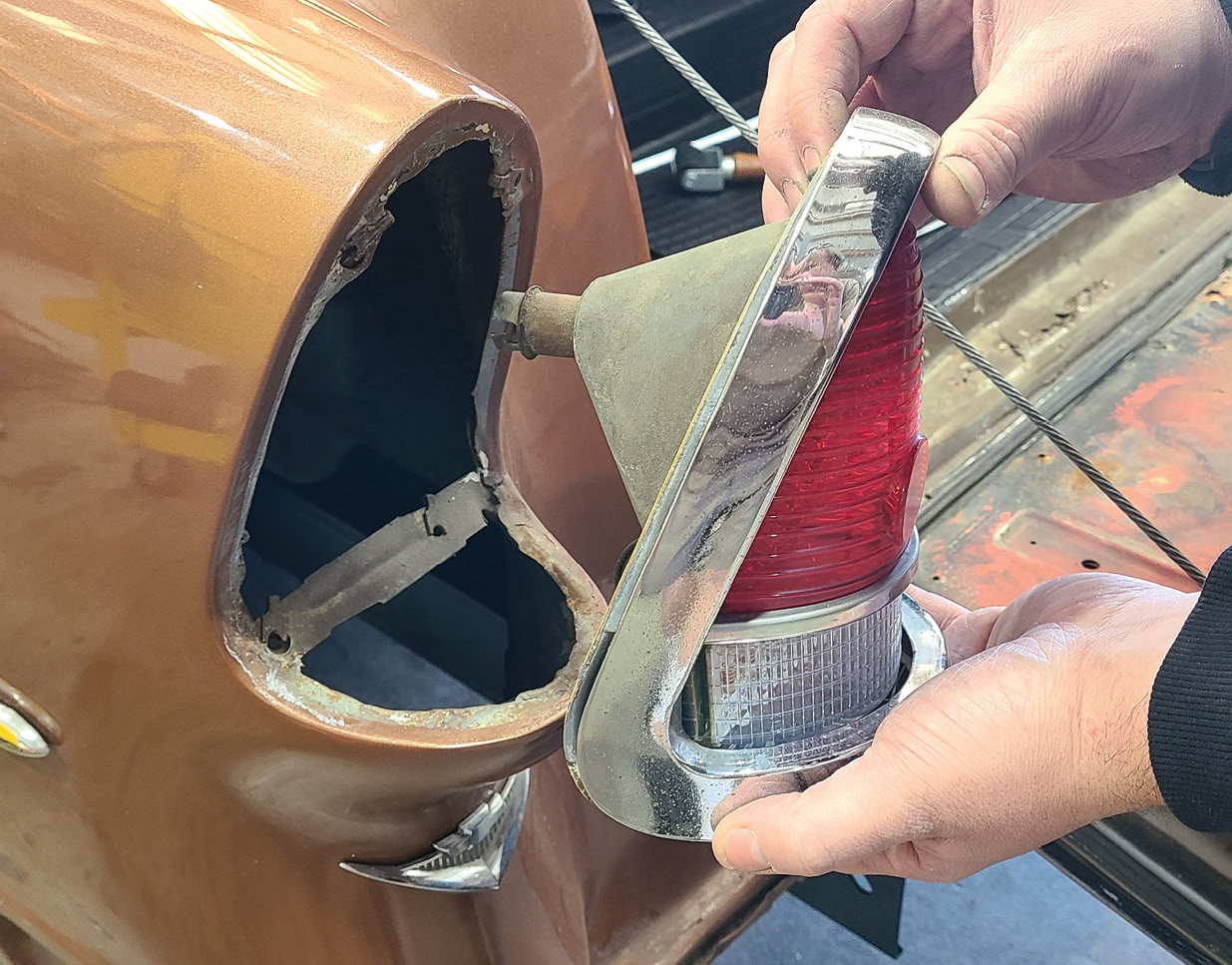 Disassembly begins with the stock taillight housing being removed from the vehicle. 