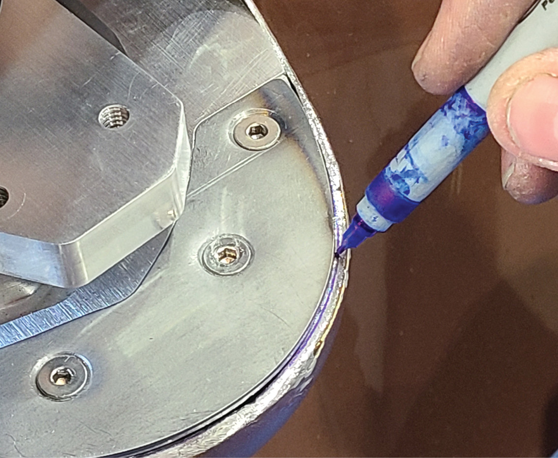 Fine-tuning the base’s fitment meant marking the edge of the opening that needed to be ground away to ensure a tight fit. 