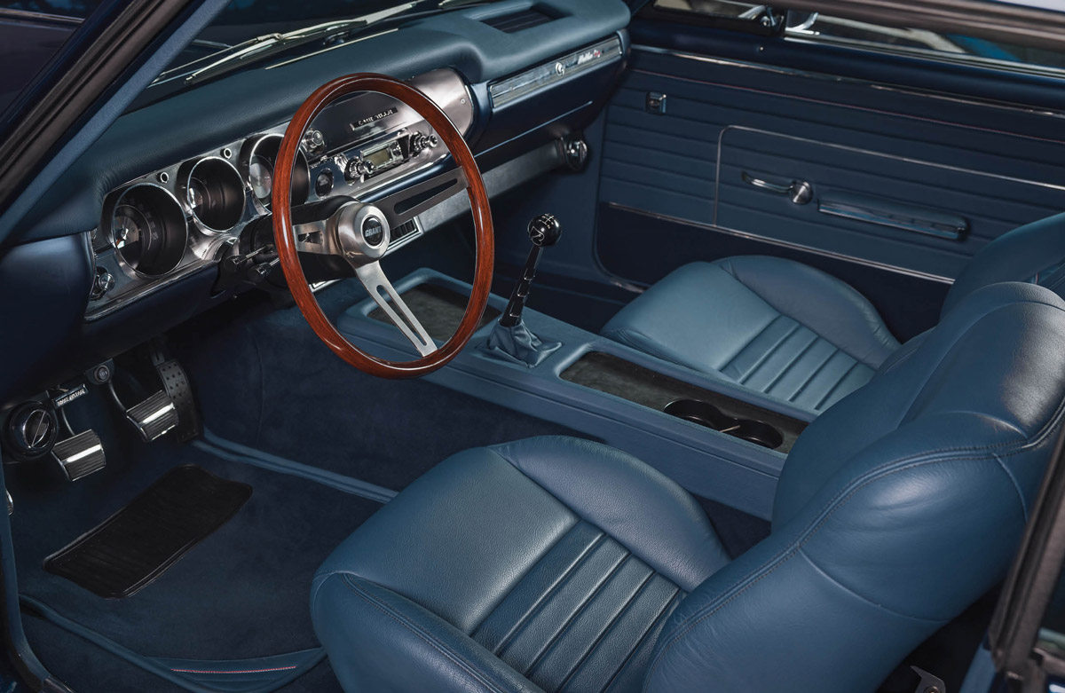 blue leather interior and dashboard inside of a ’65 Chevrolet Chevelle Malibu SS
