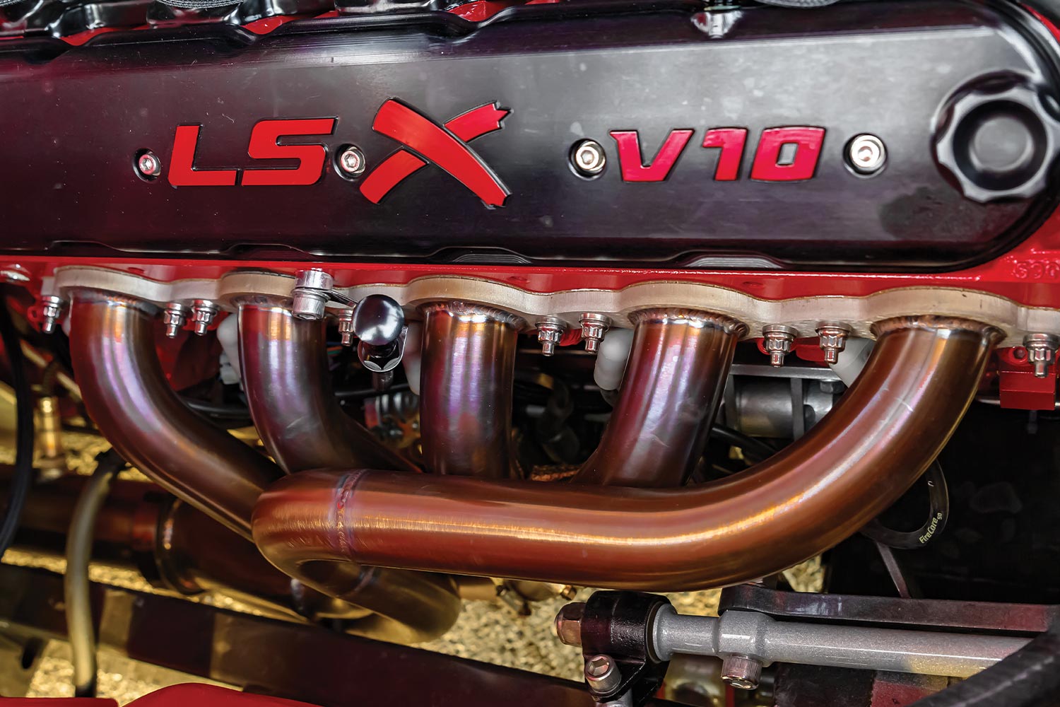 close view of the engine valve cover with LS X V10 embossed in red