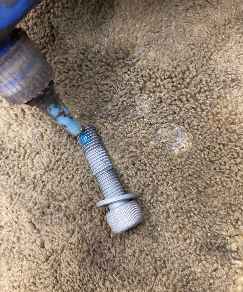 adding blue loctite to bolt