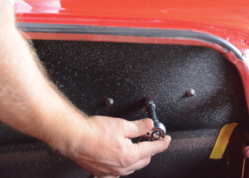 unbolting nut from quarter panel emblems