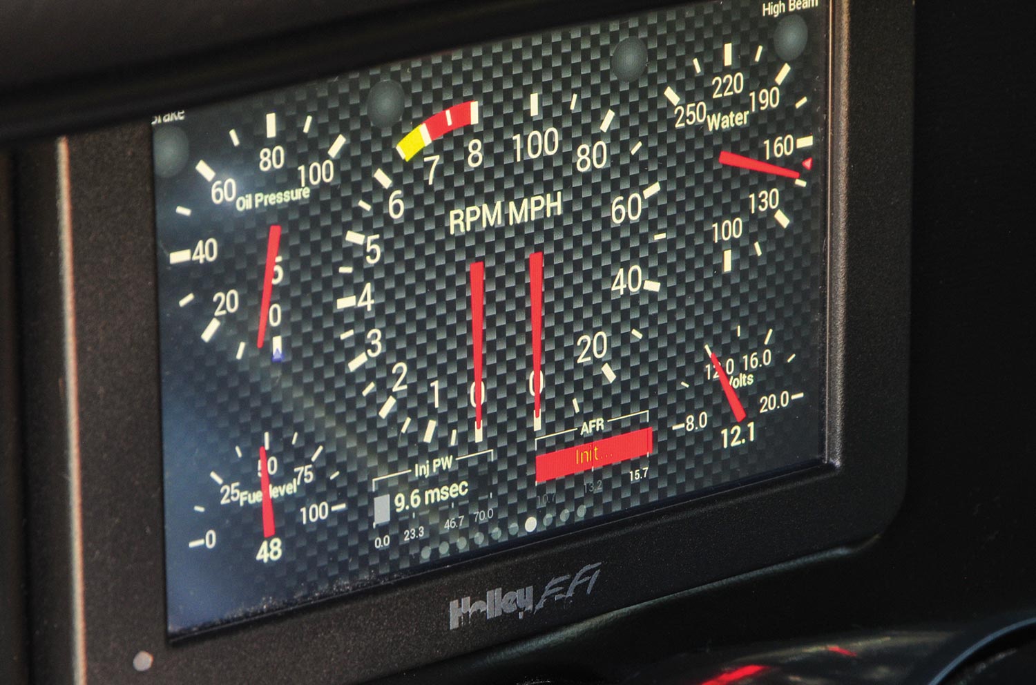 close view of the ’70 Chevy Nova's Holley LCD vitals screen behind the steering wheel