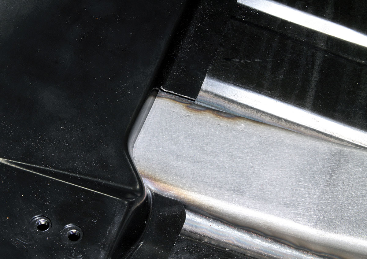 Here’s a closer look at the notch cut in the driver seat riser. A similar cut is needed for the passenger-side riser. If the risers are already installed, larger cutouts are required in order to provide sufficient room for welding around the connectors.