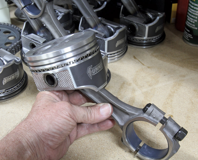 The small-block initial build included a set of Summit cast aluminum flat-top pistons with pressed pins connected to a set of resized stock connecting rods fitted with ARP through bolts and nuts.