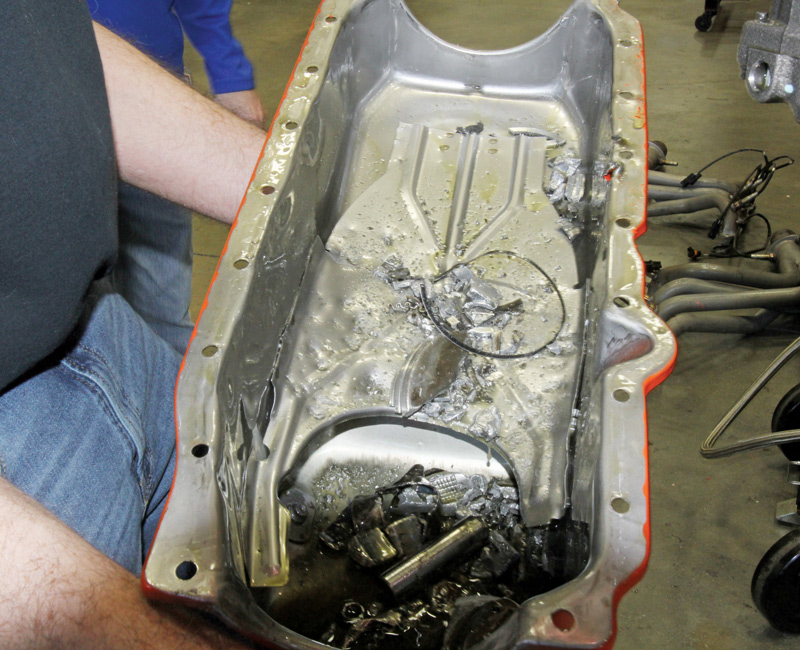 This led to the discovery of lots of little pieces of piston and connecting rod in the oil pan along with a single rod bolt and nut also lying amidst the debris.