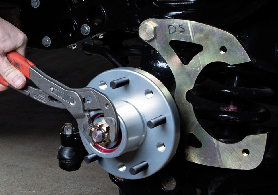 Next, spin on the castle nut and tighten as you spin the hub simultaneously. You’re just looking for a slight drag as you tighten the nut. Overtightening can prematurely wear the bearings. Finally, line up the castle nut to accept the cotter pin.