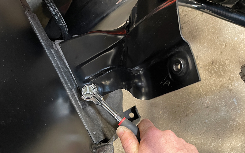  To tie everything together underhood, AMD inner fender braces were installed to the firewall base using a ½-inch socket and wrench with stock hardware.