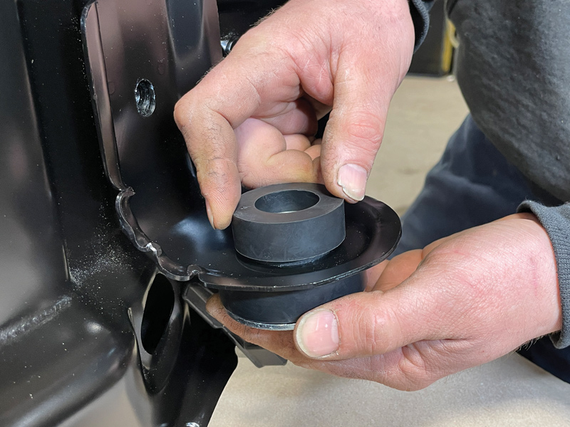 Next, a radiator support bushing mount kit from AMD was used; first place the bushings at the bottom of the core support and follow with the rubber cushions added to the top.