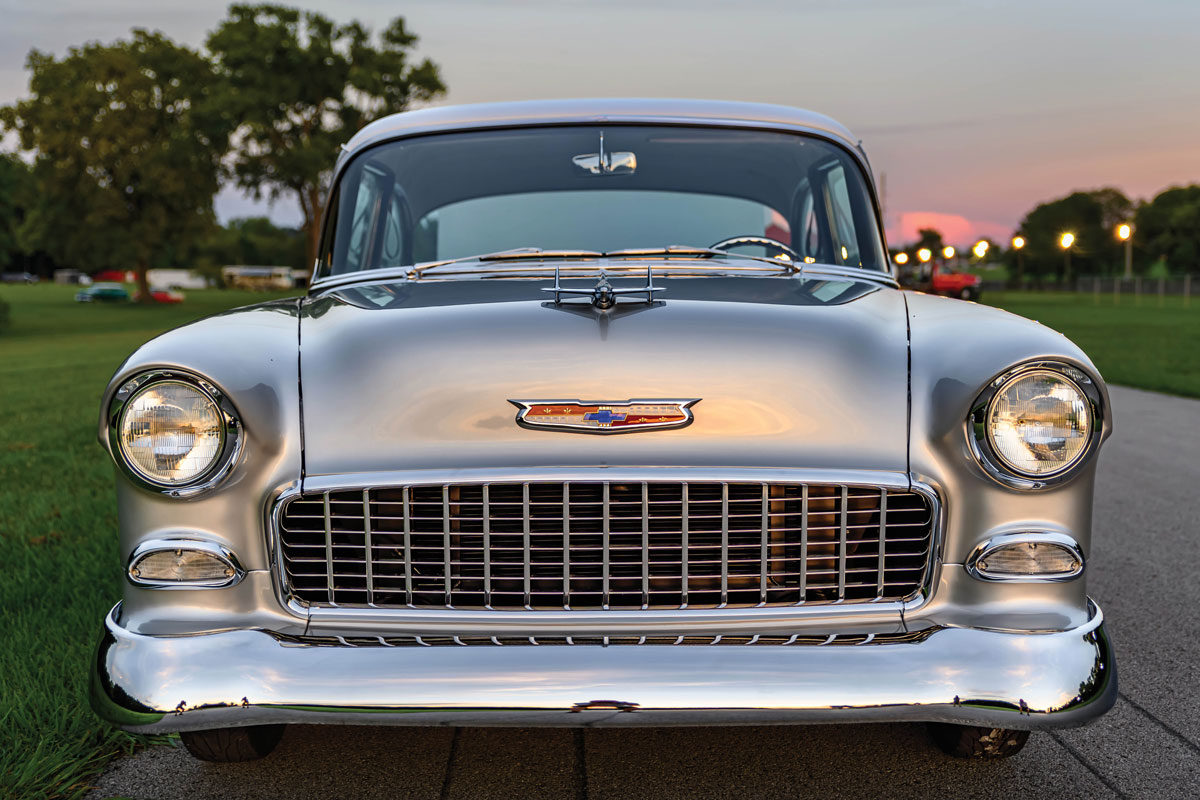 front of a ’55 Chevy 210
