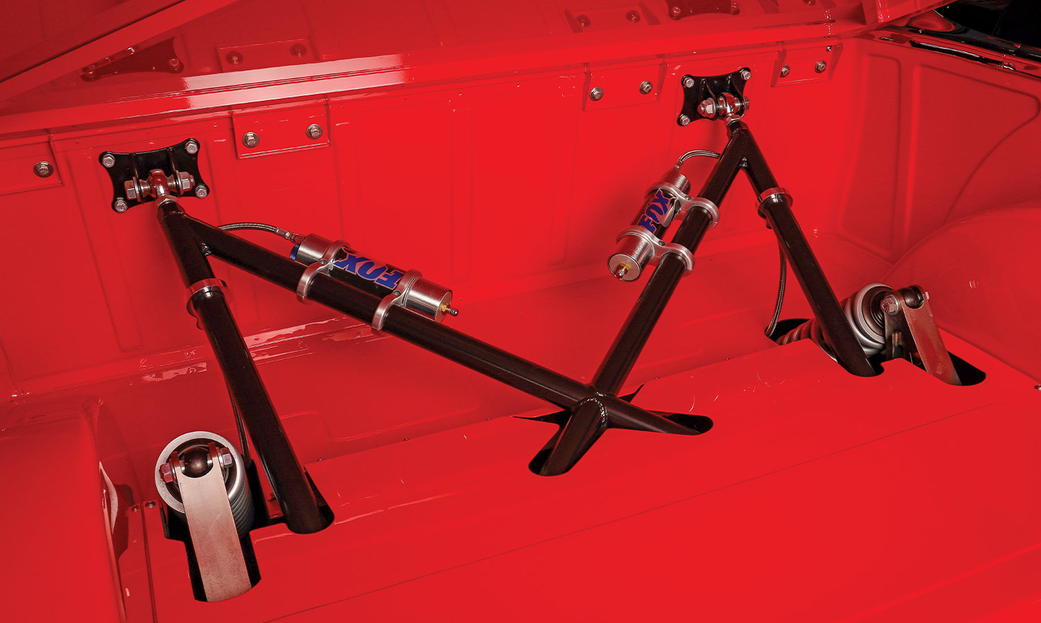 full view of the double-rail section and trick cantilever suspension system armed with Fox coilover shocks with remote reservoirs