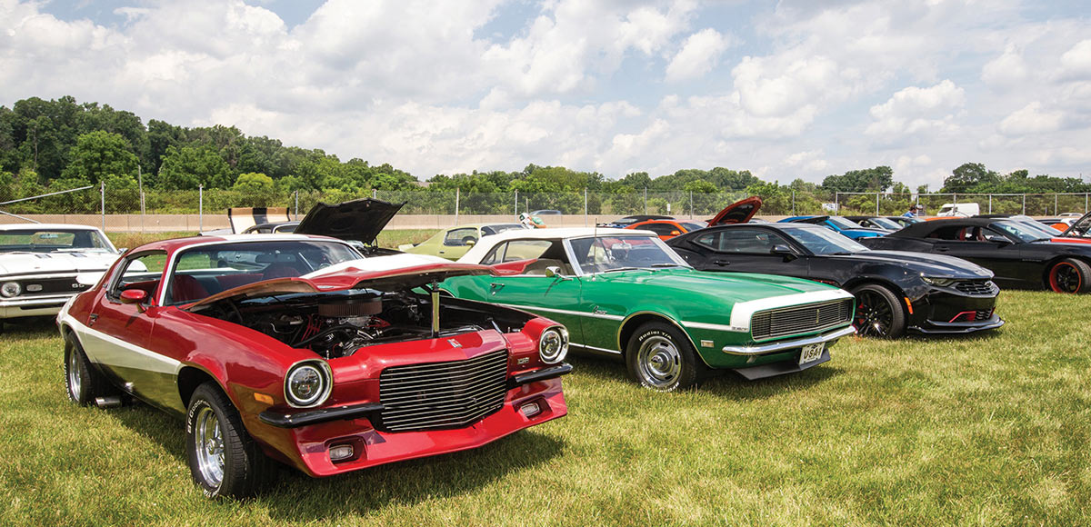 Modified red split bumper coupe, green '67 convertible and black current gen coupe