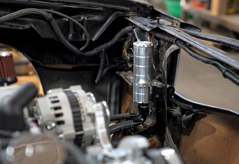 All American Billet offers two types of power steering reservoirs: an onboard reservoir and a billet remote reservoir (shown). It will need to be located somewhere higher than the power steering pump and sit upright for proper operation; illustrated in this photo shows where we installed ours.
