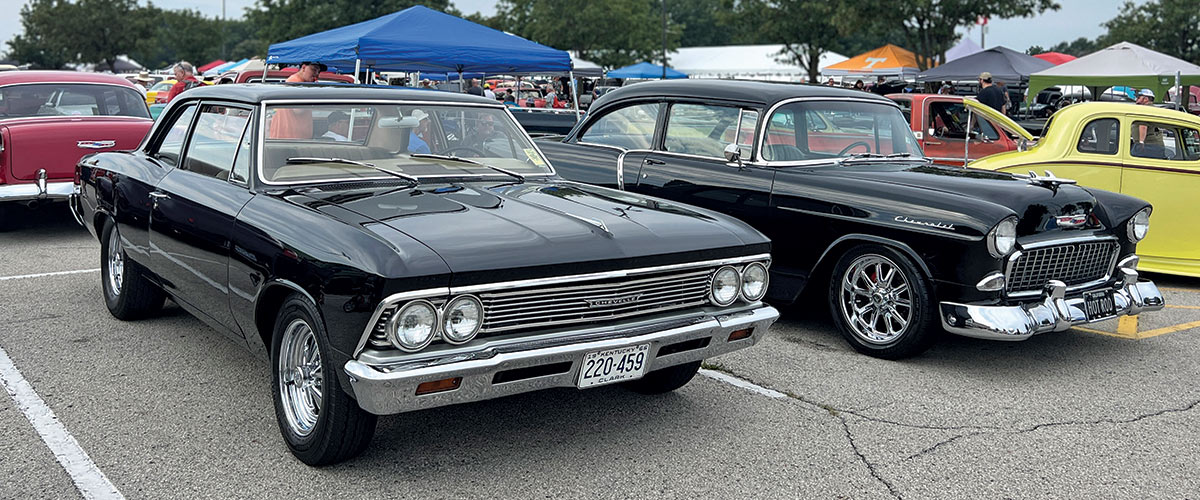 Close-up photograph perspective of two black colored vintage Chevrolet cars parked on display at the 54th annual NSRA Street Rod Nationals