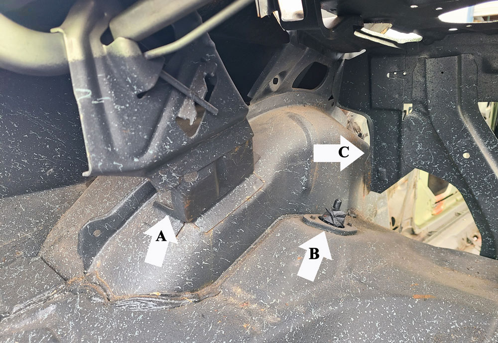 The trunk side and the rear seat area of the factory wheeltubs show some of the items that will need to be removed or modified, including the trunk decklid hinge brace (A) and the decklid’s torsion springs (careful when removing as they’re under tension). The rear shocks (B) should be removed, and the rear seat brace (C) that runs between the two rear wheeltubs will also have to be cut/modified. 