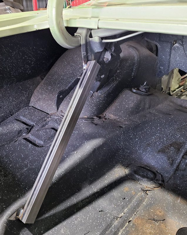 The very first thing to do is tack-weld the decklid trunk hinge brace to the vehicle’s floor so its location will not move while everything else around it will.