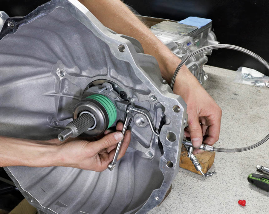 With the bellhousing back on the transmission for the last time, we proceeded to install the hydraulic line to the slave cylinder.