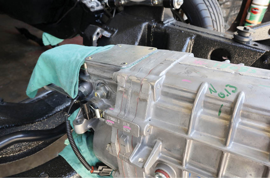 To avoid taking more out of the floor than was necessary, we used our grinder with a 4-inch flap disc to take down a couple ears on the top of the five-speed and give that extra ½ inch of clearance we needed.