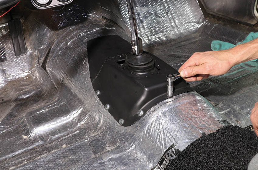 This tech story isn’t about how to do primitive at-home fabrication with basic tools and a 120V flux-core welder. As such, we’ll breeze over the modifications done to our factory four-speed hump and just say it does a good job sealing the hole in our trans tunnel. Luckily, it will hide under the carpet, so we’re good with it.