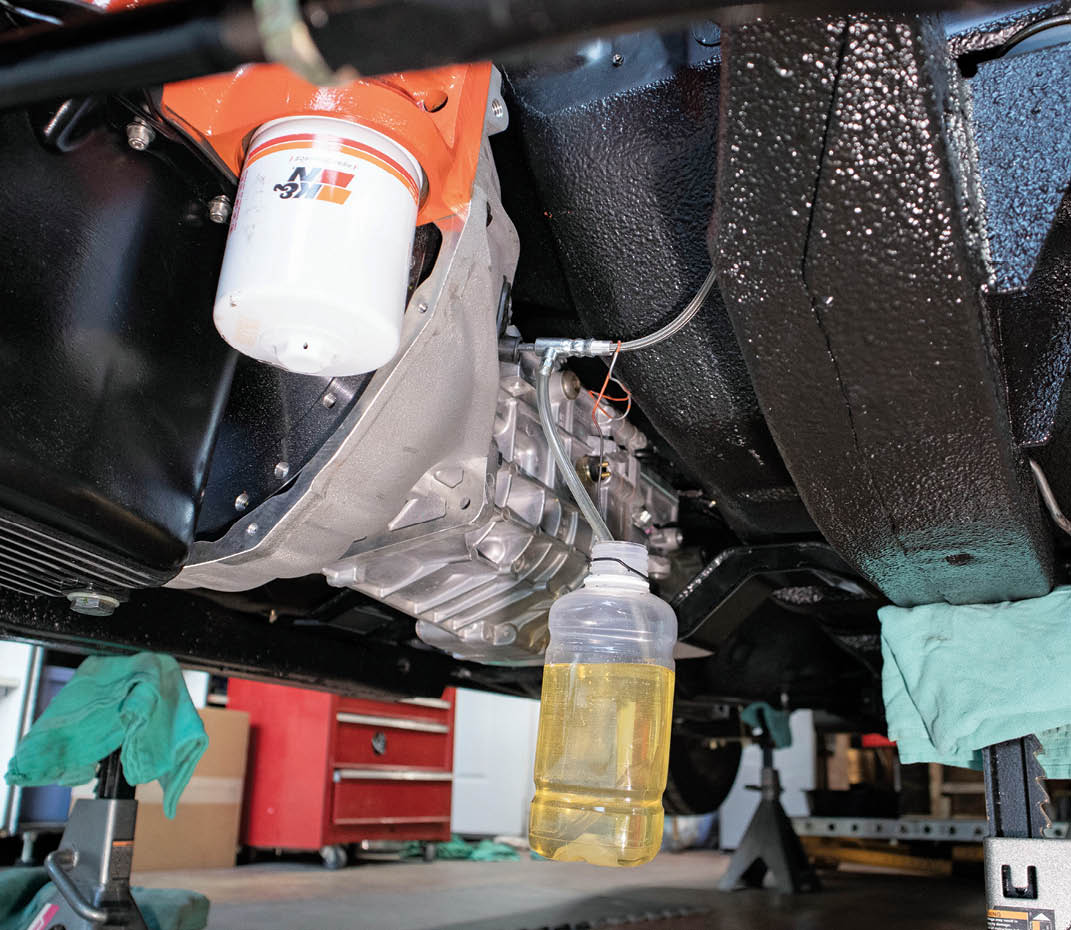 Once the reservoir was mounted with the high- and low-pressure lines hooked up, we grabbed a friend and proceeded to bleed the hydraulic clutch system. To make life a little easier, we used bailing wire to hang our bottle during the process. To make our life more difficult, we neglected to check the fluid level often enough while bleeding, which meant we had to run through a lot more fluid than we otherwise would have.