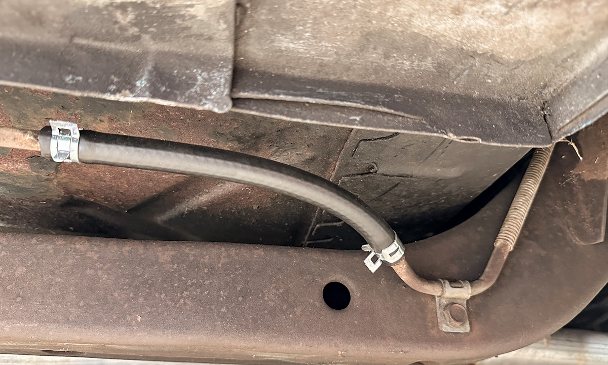 Replaced hose under passenger side fender