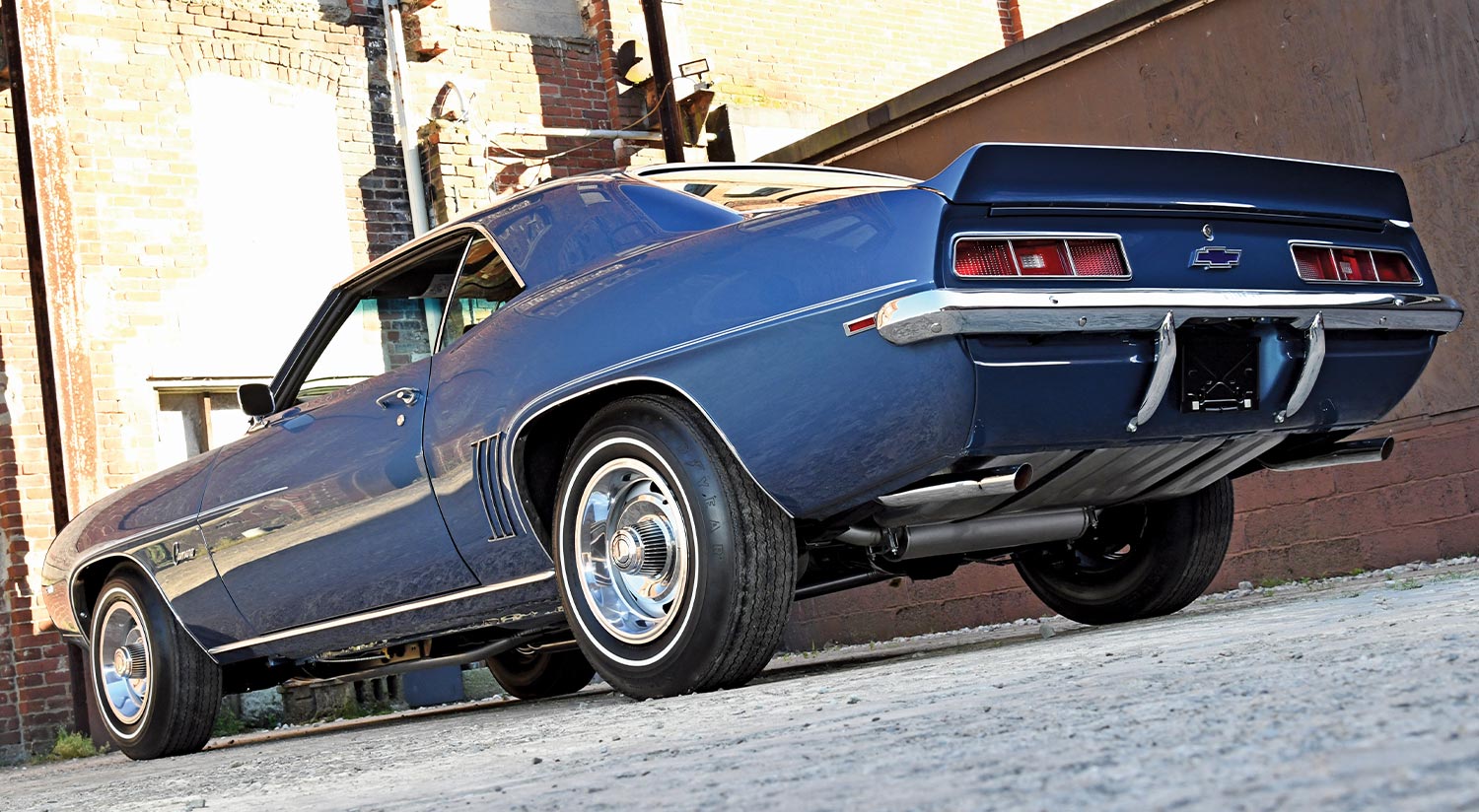 low angled rear view of the dusk blue ’69 COPO Camaro