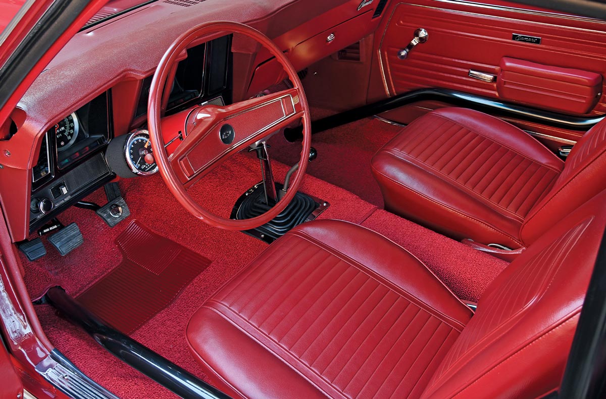 view inside the the ’69 Garnet Red COPO Camaro's open driver door