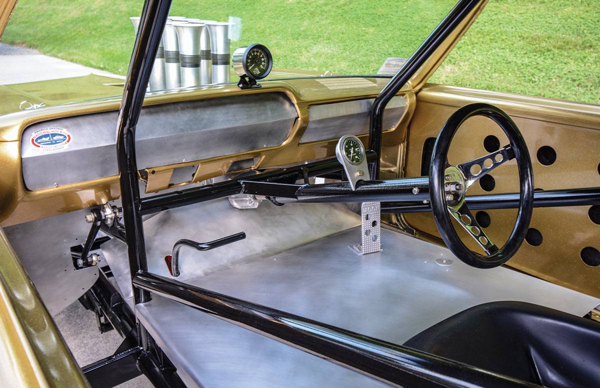 interior view through an open window of the gold ’65 Chevelle 300