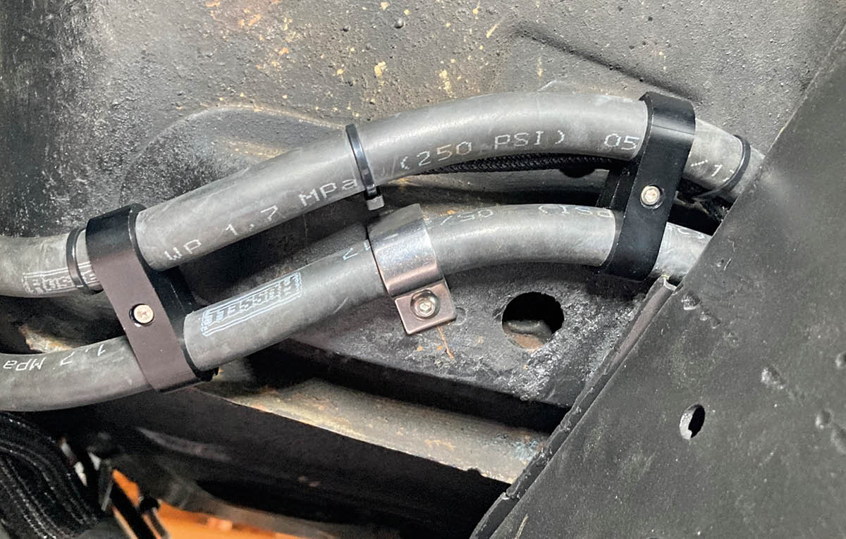 Like the engine cooler lines, the transmission cooler lines are held in place by another combination of Russell AN hose separators (PN RUS-654303) and Kugel Komponents line clamps (PN 6506), sized for the AN-6 hose that’s being used on the transmission side.