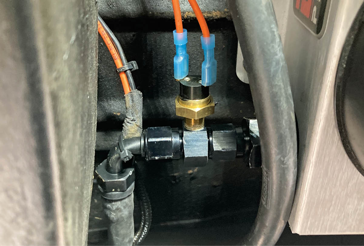 We don’t need the transmission cooler’s electric fans to run constantly, so we’ll be controlling them with a Derale In-Line Fan Control Thermostat kit (PN 35020), set to switch the fans on when the fluid entering the cooler from the transmission reaches 180 degrees.