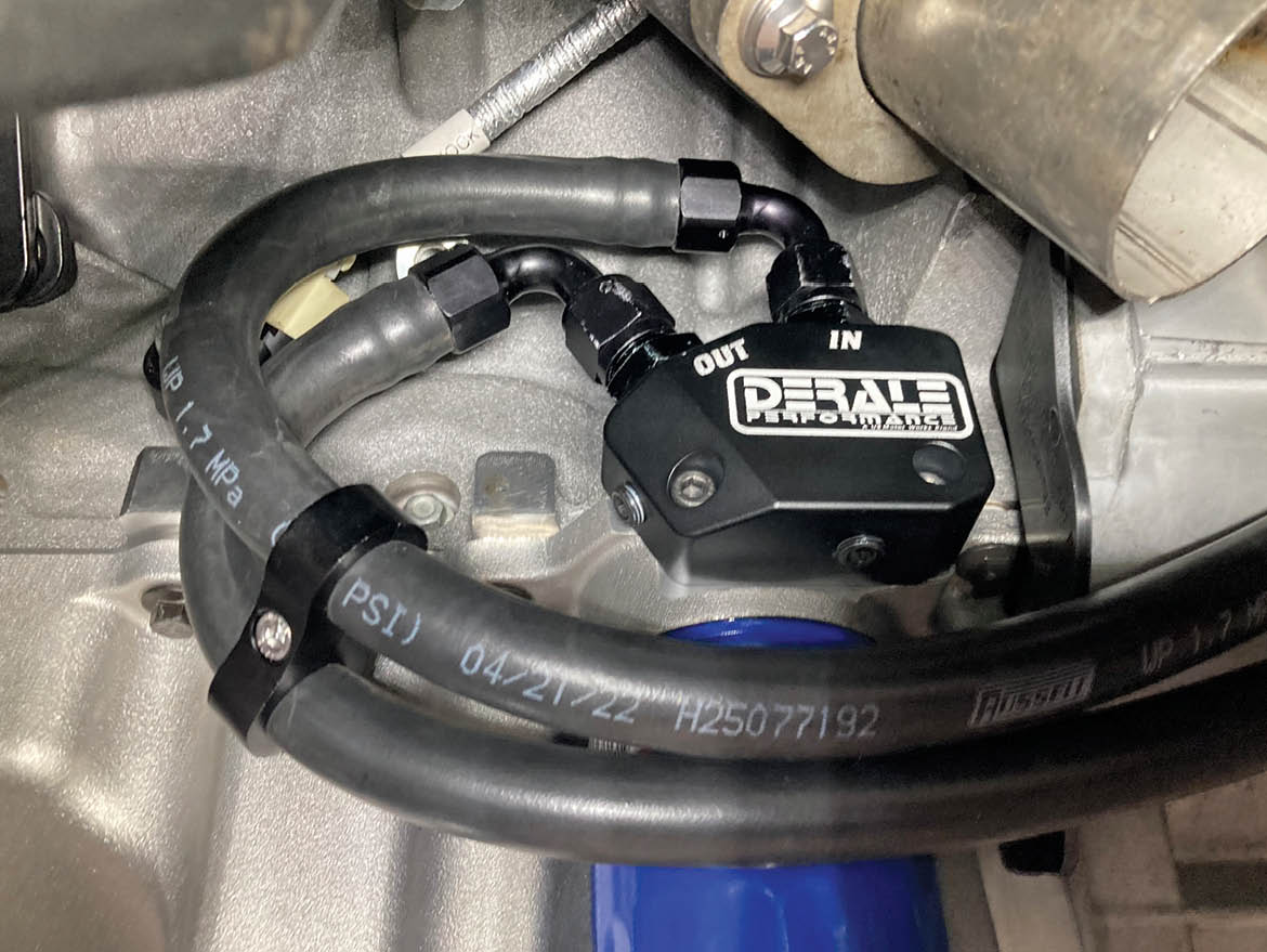 Routing the engine oil out to the cooler and back into the engine block is achieved using a Derale LS Engine Oil Cooler Adapter (PN 35611), which replaces the stock block-off adapter located just above the oil filter. Note the adapter has been equipped with AN-8 male fittings.