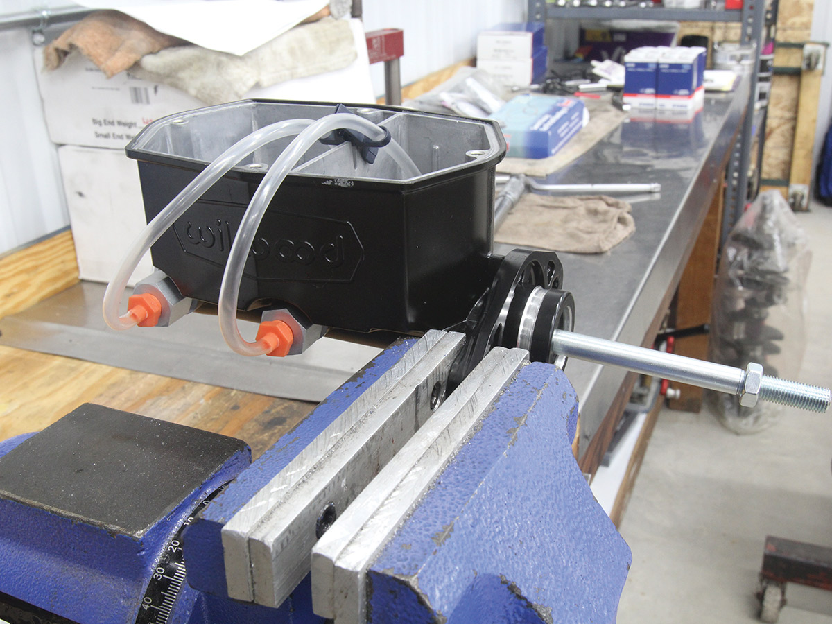 master cylinder with tubes attached, sitting on a table