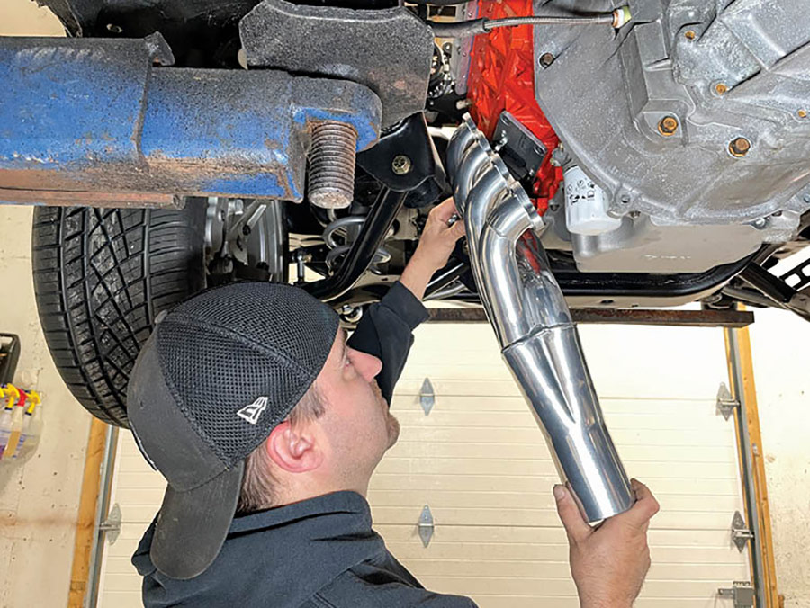 Getting started, Pat O’Brien of Procision Industries removed all spark plugs, plug wires, and dipstick tube from the engine for installation access. He then test-fitted each header and followed by loosely installing the rearmost lock washer and header bolt to secure the unit in place. Be sure to always use a dab of antiseize on your bolt threads prior to installation.