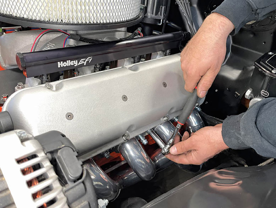 With perfect fitment secured, O’Brien then tightened the header in place evenly, starting from the center and working his way out to the farthest points.