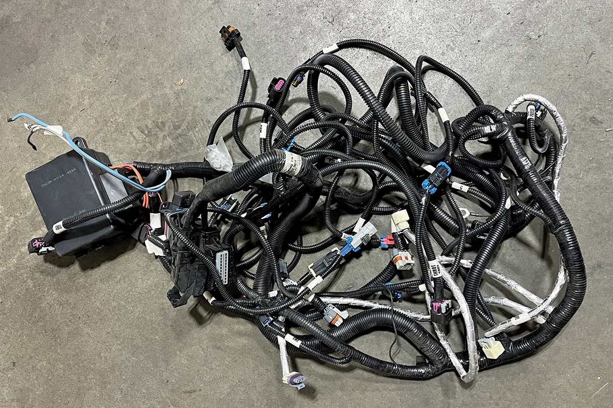 A jumble of black cords on the ground
