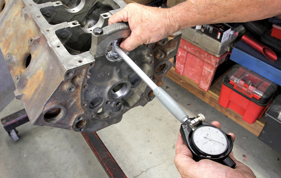 Next, we then transferred the micrometer journal diameter for the mains to a dial bore gauge. With the main bearings torqued in place, the dial bore gauge will display the clearance. On the first main, we have it right at 0.0021-inch clearance, which is very close to ideal.
