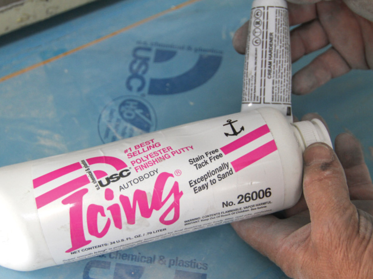 Hand holding a white bottle with pink text of icing polyester