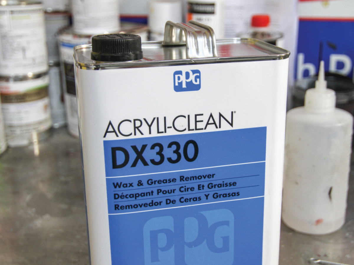 A white rectangular can with a light blue label that reads Acryli-Clean DX330