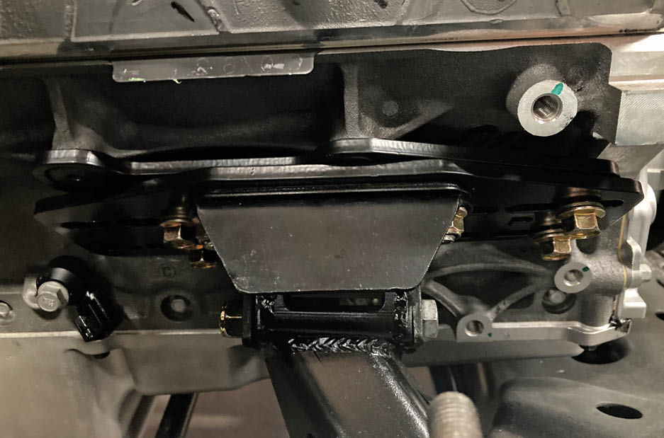 With the mounts adjusted to the furthest forward position, we noticed that there was plenty of room between the bellhousing and the firewall, while the real estate at the front of the engine was getting tight.