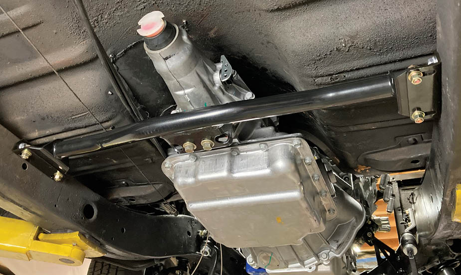 With the transmission mount secured, the drivetrain installation is complete.