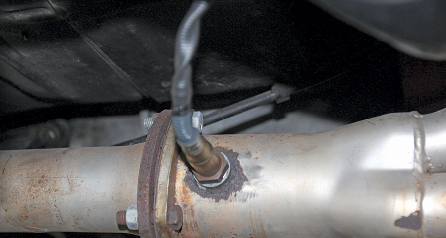 closeup of Bosch sensor installed on the exhaust pipe