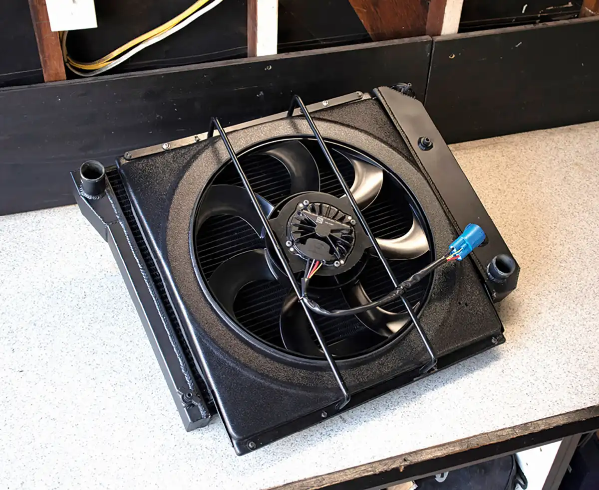 We started with mounting the fan shroud–rather, figuring out how we wanted to mount the fan and shroud to our radiator. After some deep contemplation, we decided to mount the fan and shroud flush with the top of the radiator and let the rest hang below.