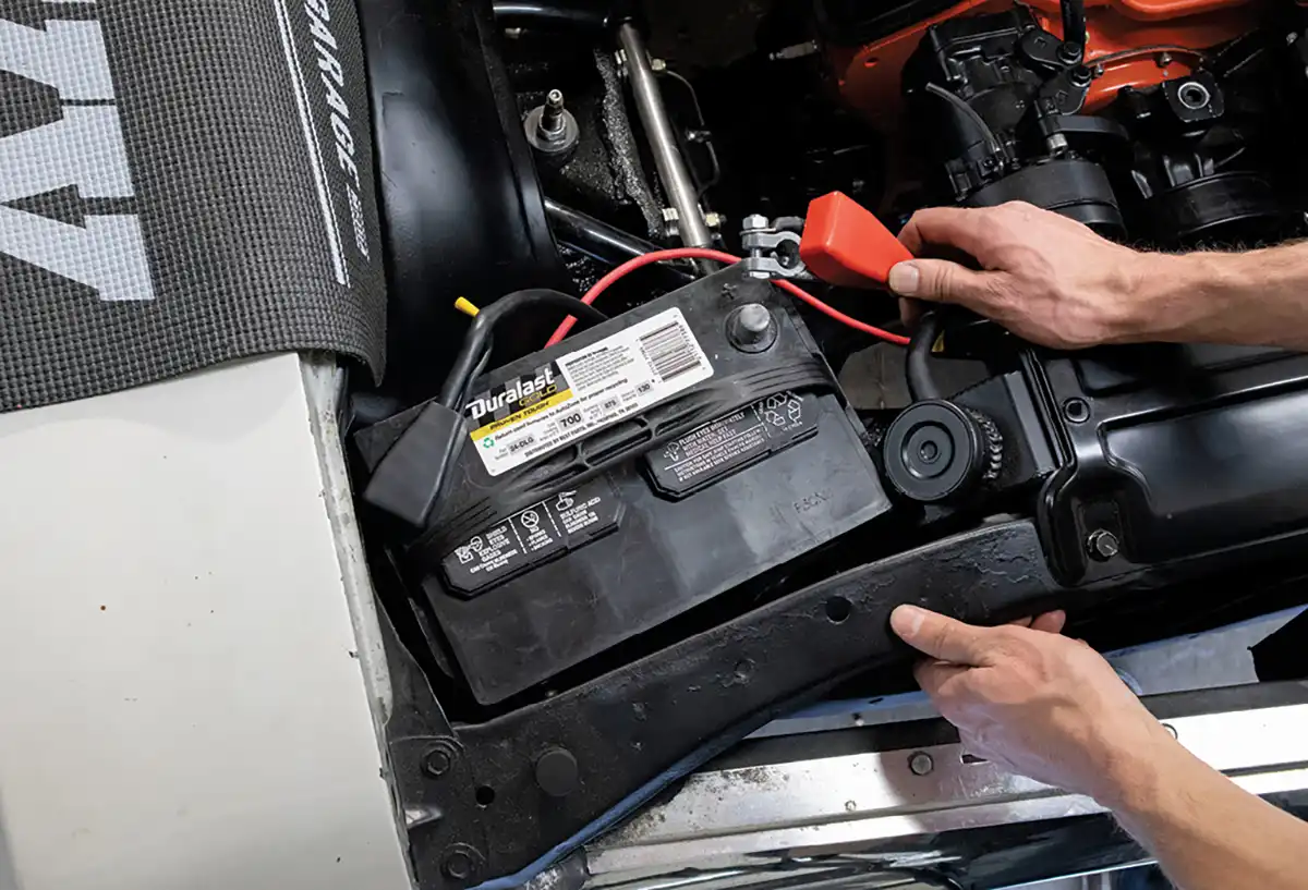 We also installed our new Duralast battery cables. The cables are universal for positive and negative since they come with both black and red battery terminal covers. We simply found the lengths that fit best for our engine bay, slipped on the correct cover, and bolted them on.