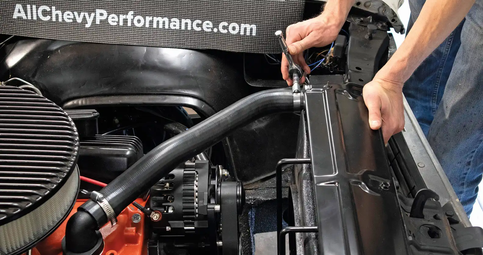 After installing the thermostat housing we went ahead and fitted new upper and lower radiator hoses, also from Duralast.